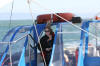 Chris sensibly stays out of the sun and wind