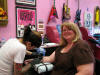 Chris getting her tattoo